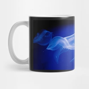 Translucent jellyfish in deep blue water Mug